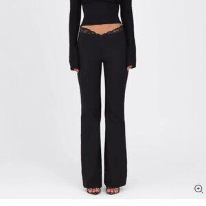Women's low waisted black work pant with lace detailing